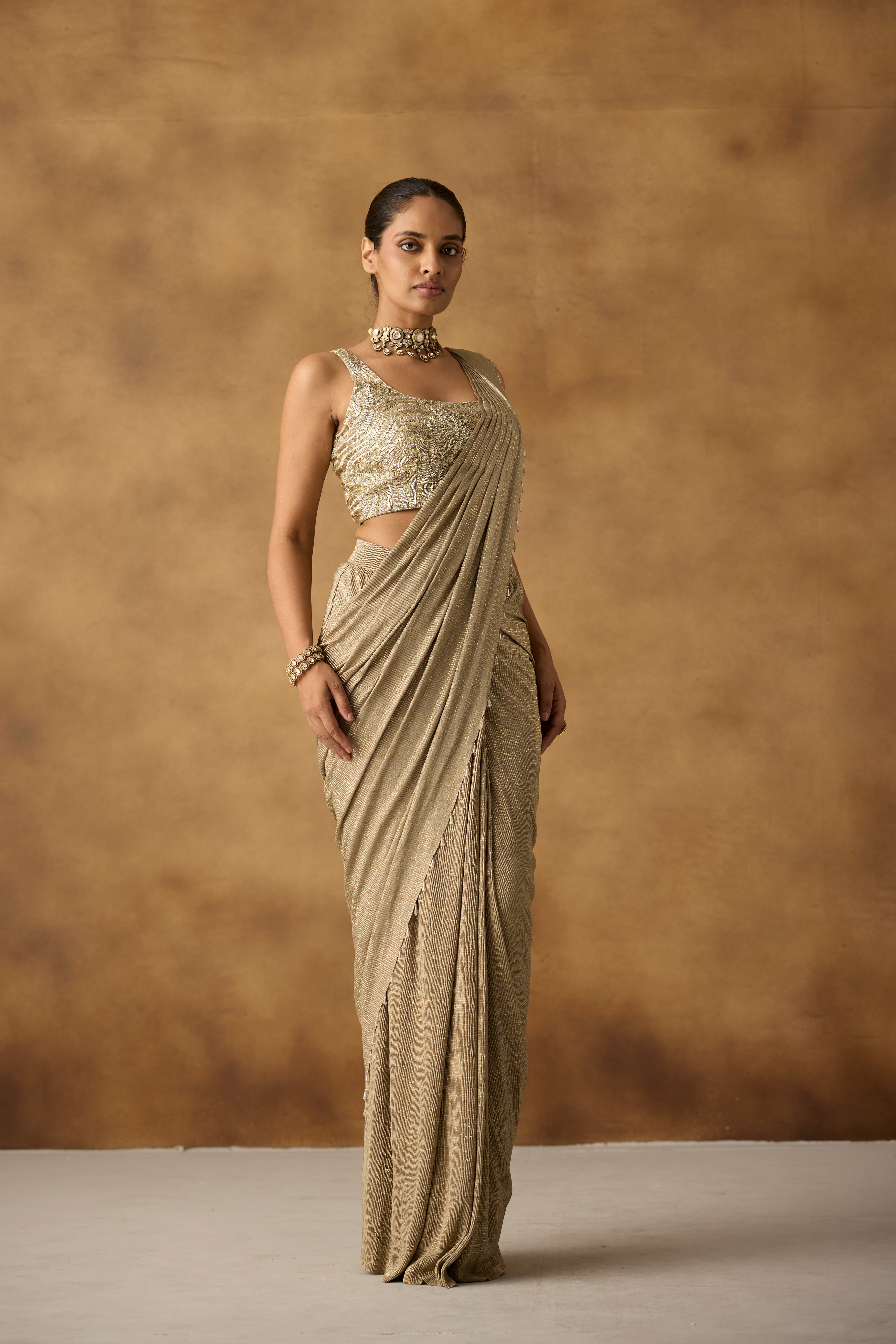 Beige Gilded Embellished Crepe Silk Draped Saree