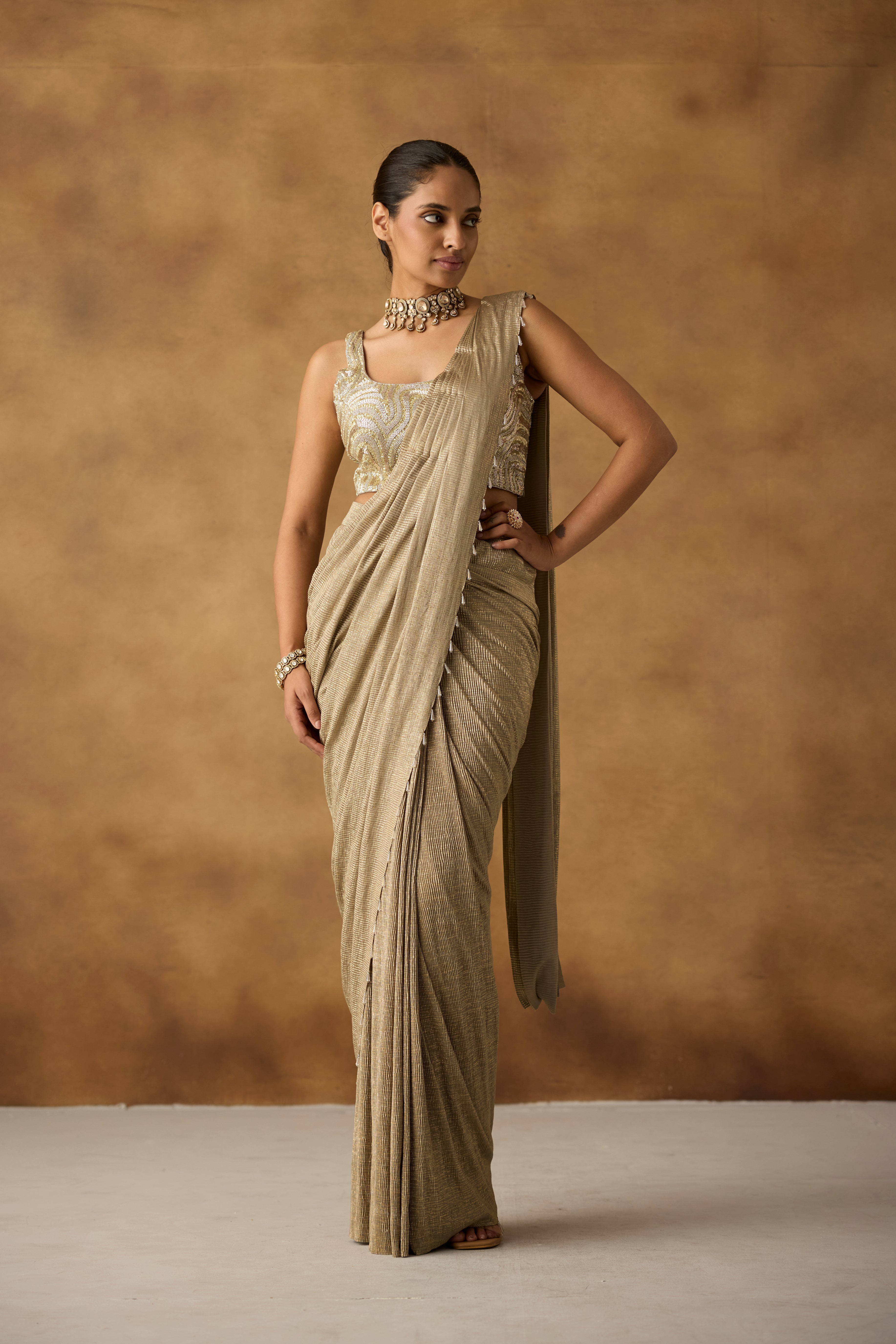 Beige Gilded Embellished Crepe Silk Draped Saree