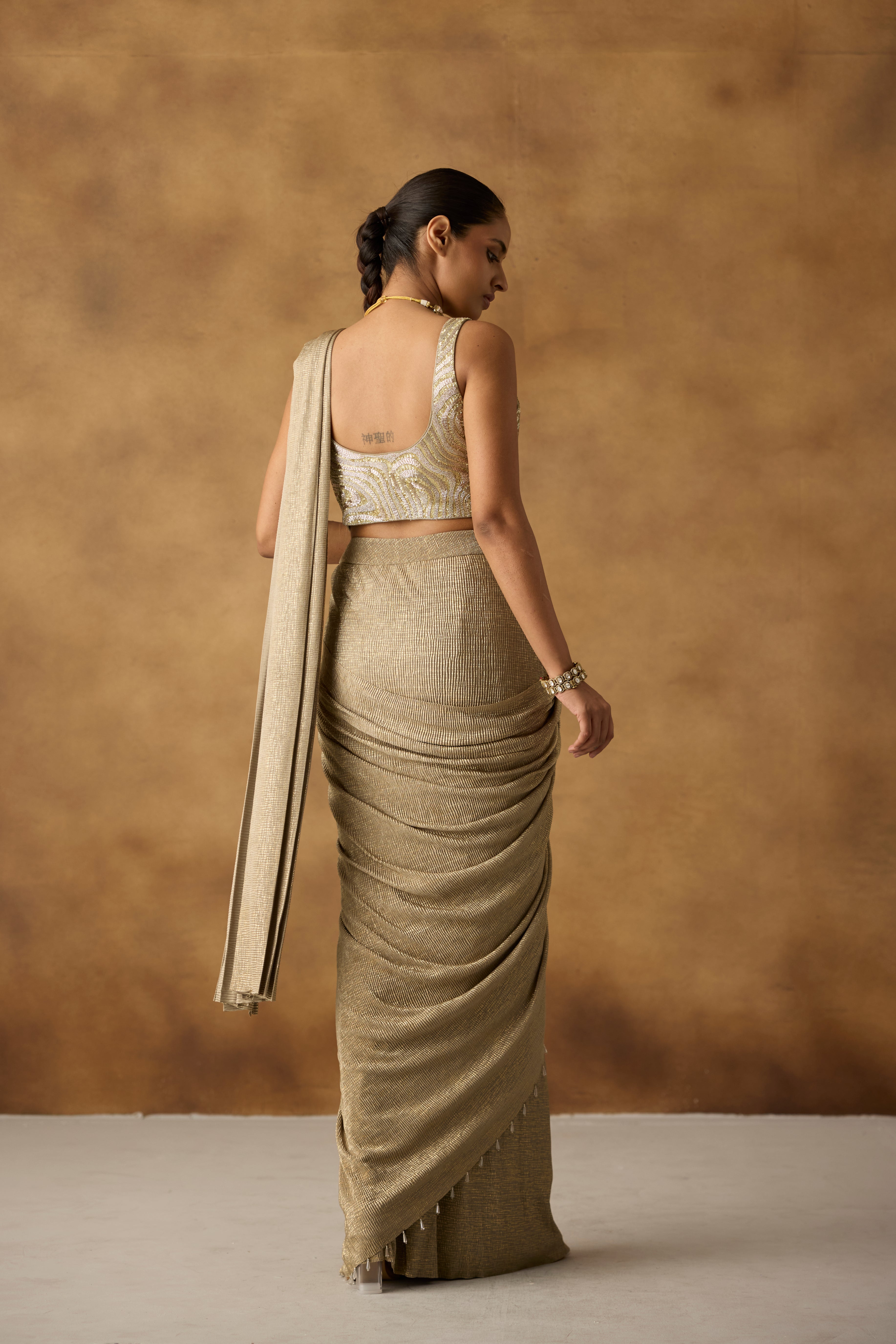 Beige Gilded Embellished Crepe Silk Draped Saree