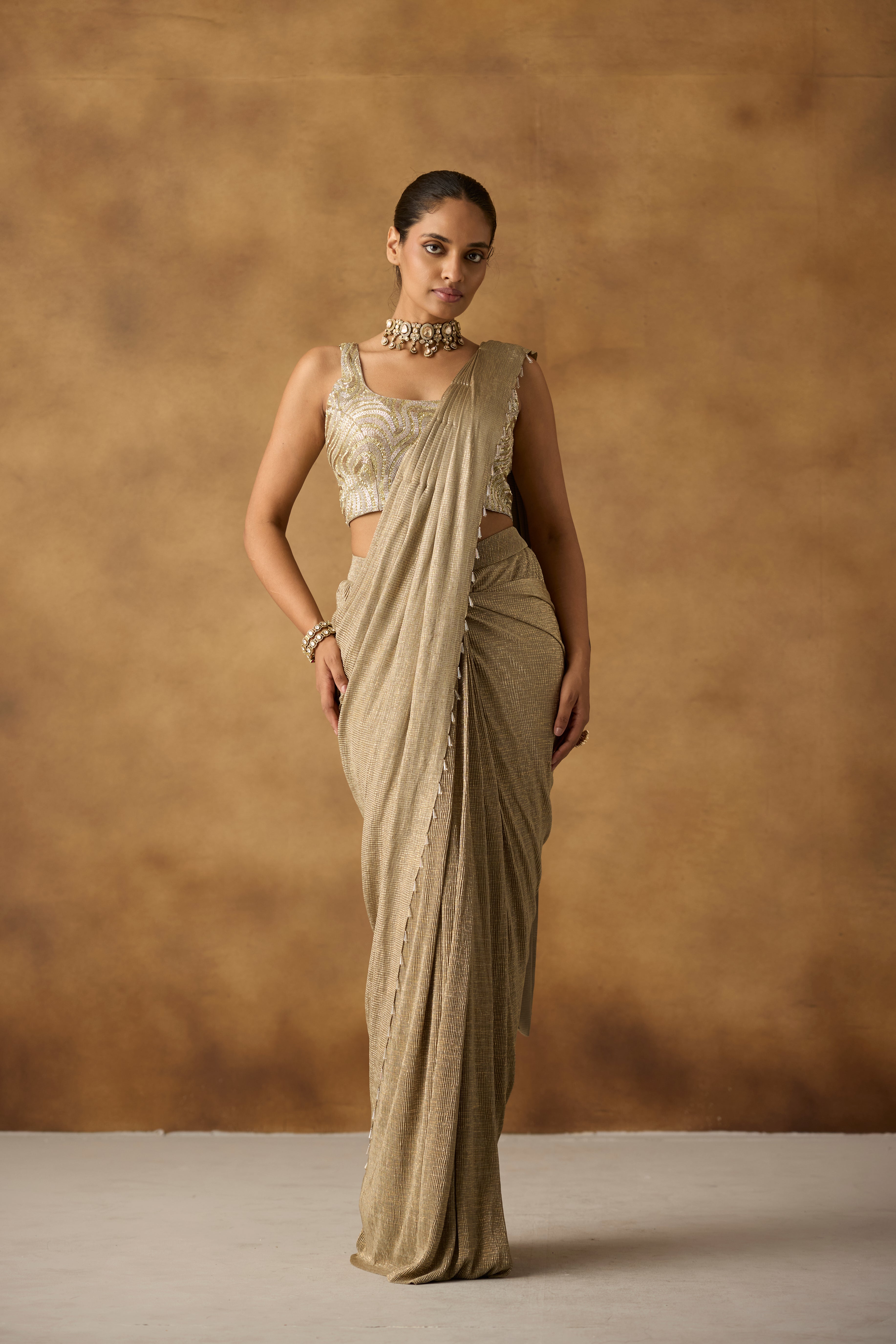 Beige Gilded Embellished Crepe Silk Draped Saree