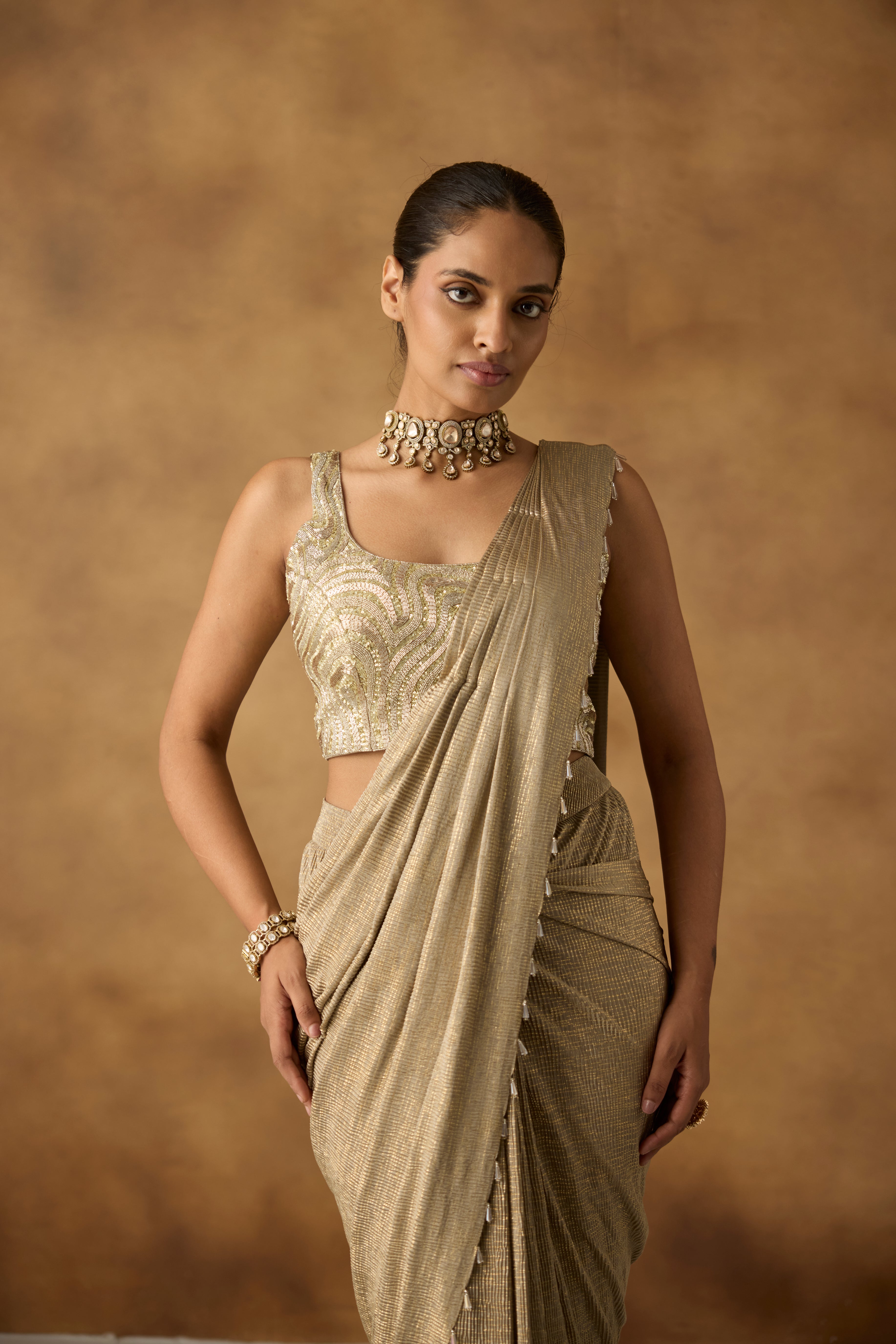 Beige Gilded Embellished Crepe Silk Draped Saree