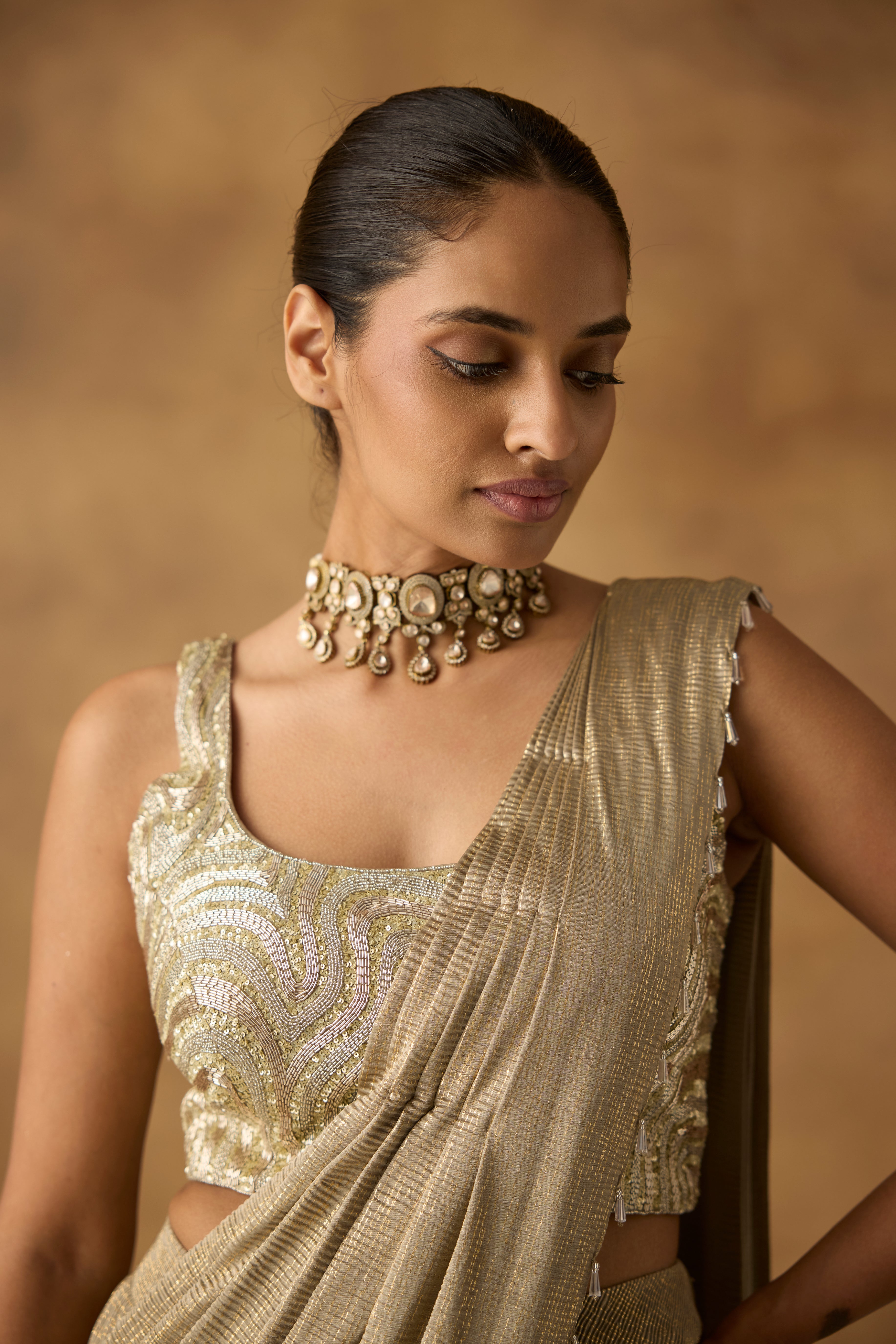 Beige Gilded Embellished Crepe Silk Draped Saree